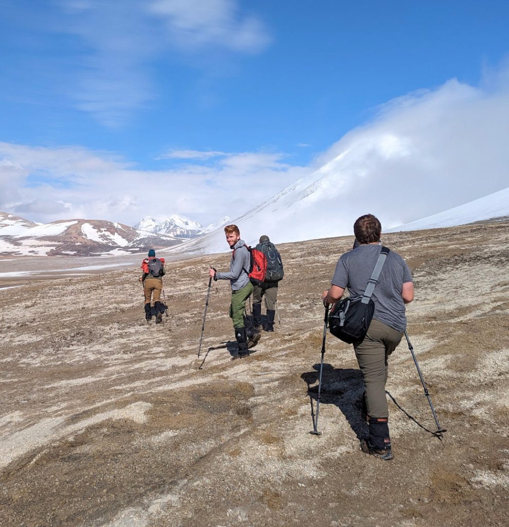Cameron Fetter hiking in Alaska with three other people (Katmai National Park)