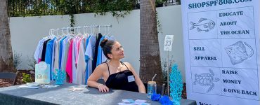 Hope Gonzalez looking at a banner for SPF805